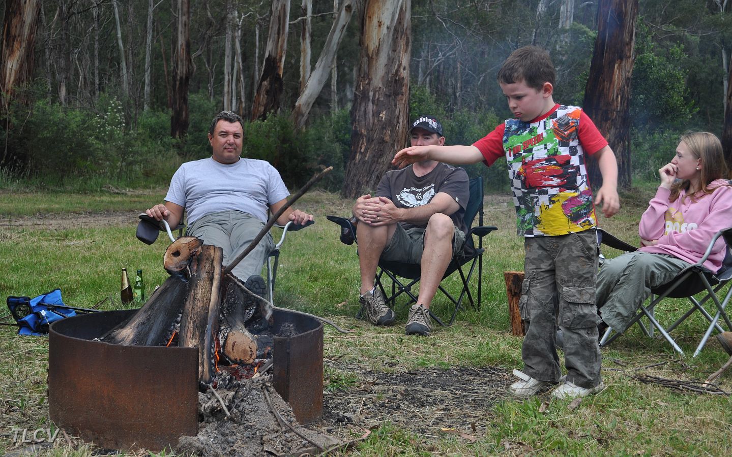08-George watches Connor feeding the fire.JPG